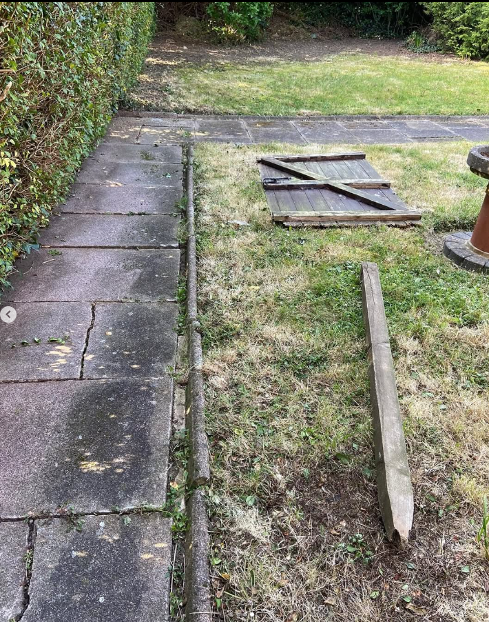 Screenshot 2025-07-12 182422 gate post and door on grass awaiting repair